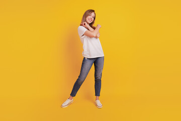 Fototapeta na wymiar Full length body size of positive glad girl dance carefree have fun on yellow background