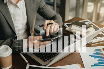 Business man working at office with laptop and documents on his desk, financial adviser analyzing data.