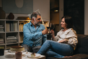 middle age couple drinking wine at home.