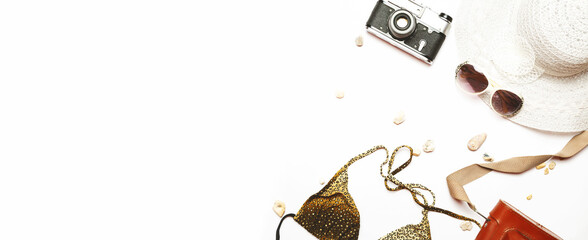 Summer items fashion tourism woman swimsuit Bikini and big hat, camera. Travel concept. white background. copy space