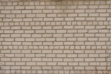 White old brick textured wall, yellowed with time. Brick background. 