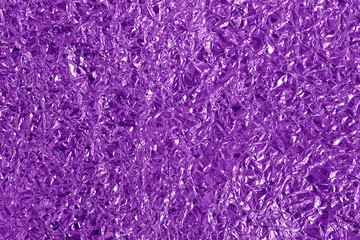 Obraz premium Purple metallic foil shiny texture, wrinkled wrapping paper for background and design art work.