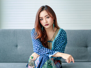 Young, beautiful cute Asian girl, dressed in gypsy style casually clothes with self-confident...