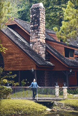 young farmer with small hut in the farm or forest,Thailand country farm