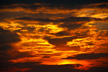 Beautiful sunset sky, yellow clouds (background)