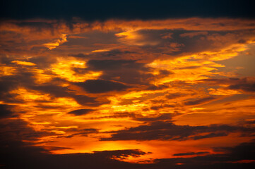 Beautiful sunset sky, yellow clouds (background)