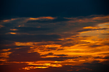 Beautiful summer sunset sky, yellow clouds