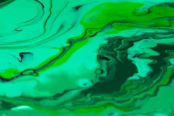Fototapeta na wymiar Fluid drawing technique. Green fluid. Grass abstraction. Mixed shades of green.