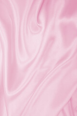Smooth elegant pink silk or satin texture as wedding background. Luxurious background design