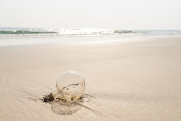 Fototapeta na wymiar Old lamp With rust on a beach with sand.