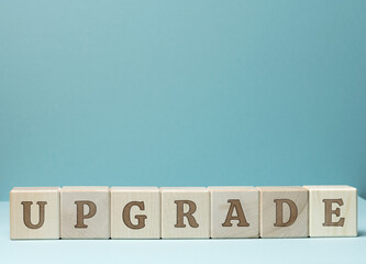 inscription upgrade on wooden cubes. Updating and upgrading, improving programs and products
