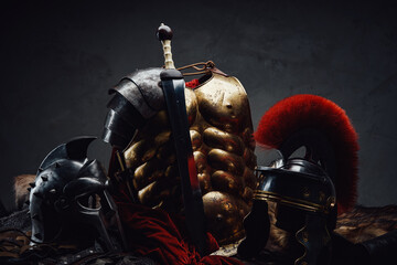Gladius and bronze armor with two helmets