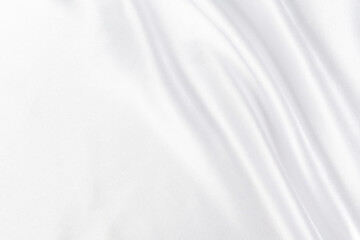 Fototapeta na wymiar Abstract white silk fabric texture background. Cloth soft wave. Creases of satin