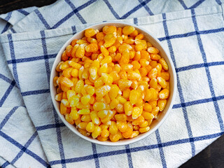 Tasty ripe corn kernels in a bowl. 
