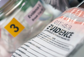 Detail of DNA sampling tubes in Laboratorio forensic equipment, conceptual image