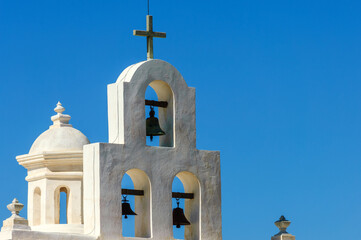 White bell tower of Mission San Xavier del Bac (famous White Dove of the Desert) in Tohono O'odham...