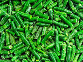 Green frozen string beans background. Top view