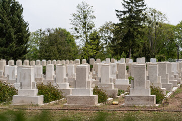 Many tombs in rows, graves on military  cemetery