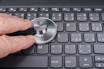 Stethoscope on a computer keyboard