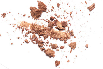 Scattered eyeshadows powder isolated on the white background.