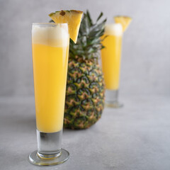 Refreshing freshly made fruit juice on a glass , fresh pineapple juice.