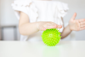 Child training tactile system with relief ball.