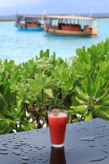 sweet watermelon cocktail on the table in nature