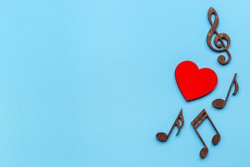 Love songs - musical wooden notes with heart, top view