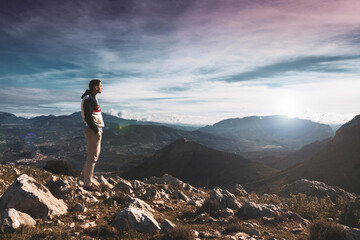 Fototapeta premium young man posing in a landscape of a mountain