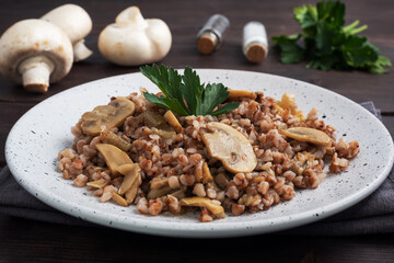 Boiled buckwheat with stewed mushrooms. Russian traditional food. Healthy diet food.
