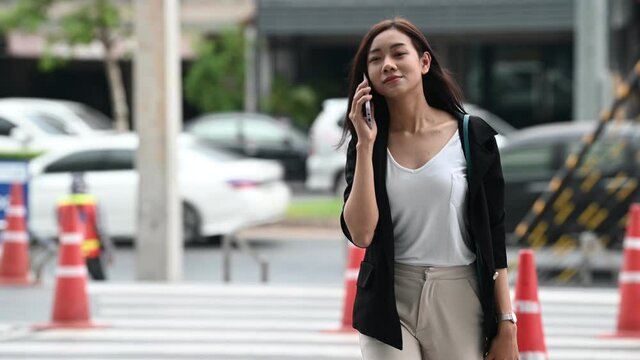 Young asian beautiful businesswoman walking at department store 