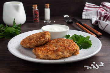 Buckwheat cutlets with cheese and parsley on a plate. Healthy diet food