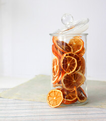 dried fruit in a jar and on the table. vegetarianism and healthy eating. energy for all time from healthy food. beautiful fruits in jars. weight loss. orange white glass. High quality photo