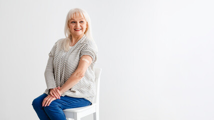 Mature Female Showing Vaccinated Arm After Antiviral Injection, White Background