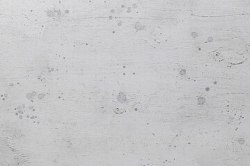 Gray wooden background with paint spots. Abstract wooden backdrop with space for text