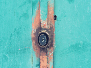 Rusty housing of armored door padlock. Additional secure component