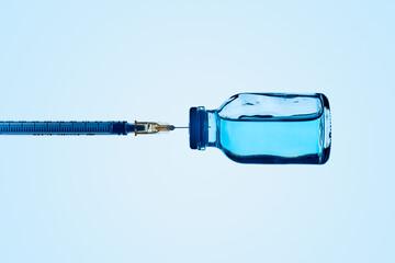 syringe in a vaccine vial