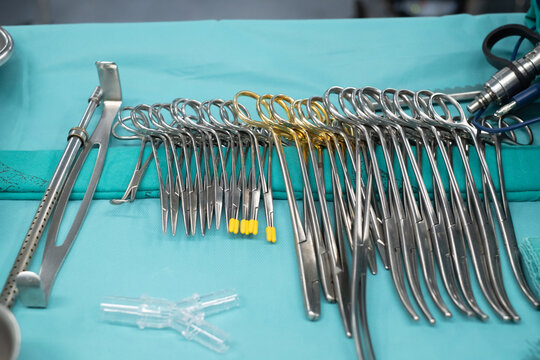 Sterile scissors and other medical instruments. Surgical equipment and medical devices in operating room. Sterile scissors and other medical instruments.