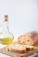 Fresh ciabatta bread on a wooden board. Copy space