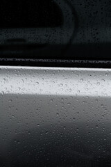 Water adheres to the surface of cars and glass.