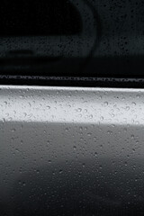 Water adheres to the surface of cars and glass.