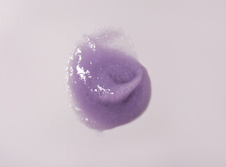 Skin scrub smear on white background. Cosmetic product. Cleansing and exfoliating your skin