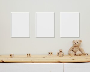 3 blank vertical frames mockup on wall for nursery wall art display, baby room three white frames mock up, wooden shelf, soft toys and wooden toys on shelf. - obrazy, fototapety, plakaty