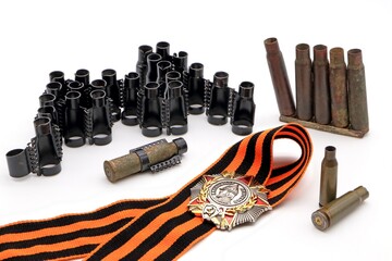 Order of Alexander Nevsky on the St. George ribbon, machine gun belt and cartridge cases on a white...