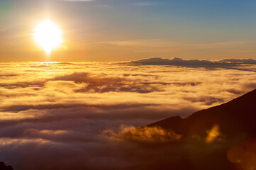 Sunrise over clouds at summit of Haleakala , Maui, Hawaii