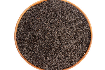 Healthy basil seeds in wooden bowl on white background, top view