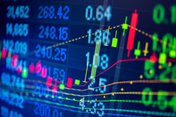 Abstract financial trading graphs and digital number of foreign exchange market trading on monitor. Background of gold and blue digital chart to represent stock market trend.