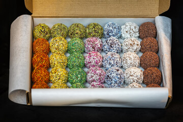 Box of Truffles with Chocolate and Rum. Coated in coconut and sprinkles, handmade