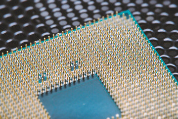 Close-up of a part of a microprocessor in soft focus under high magnification. Details of a computer component under a microscope.