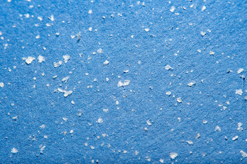 Fine house dust in soft focus under high magnification